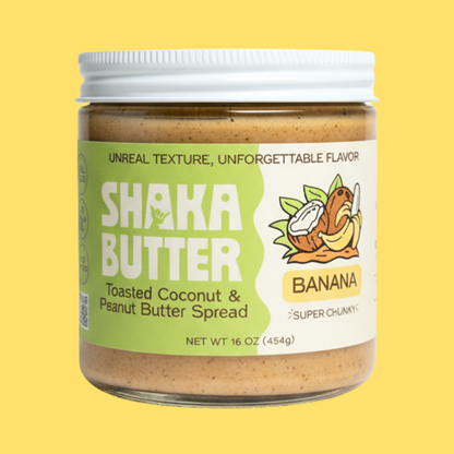 Jar of Shaka Butter Toasted Coconut & Peanut Butter Spread on a yellow background
