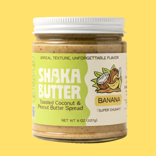 A jar of Banana Shaka Butter on a yellow background