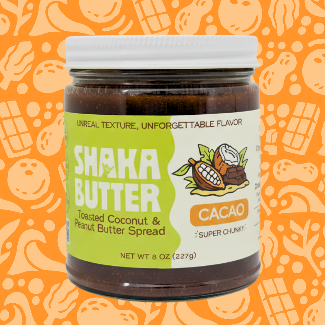 A jar of Cacao Shaka Butter on an orange patterned background