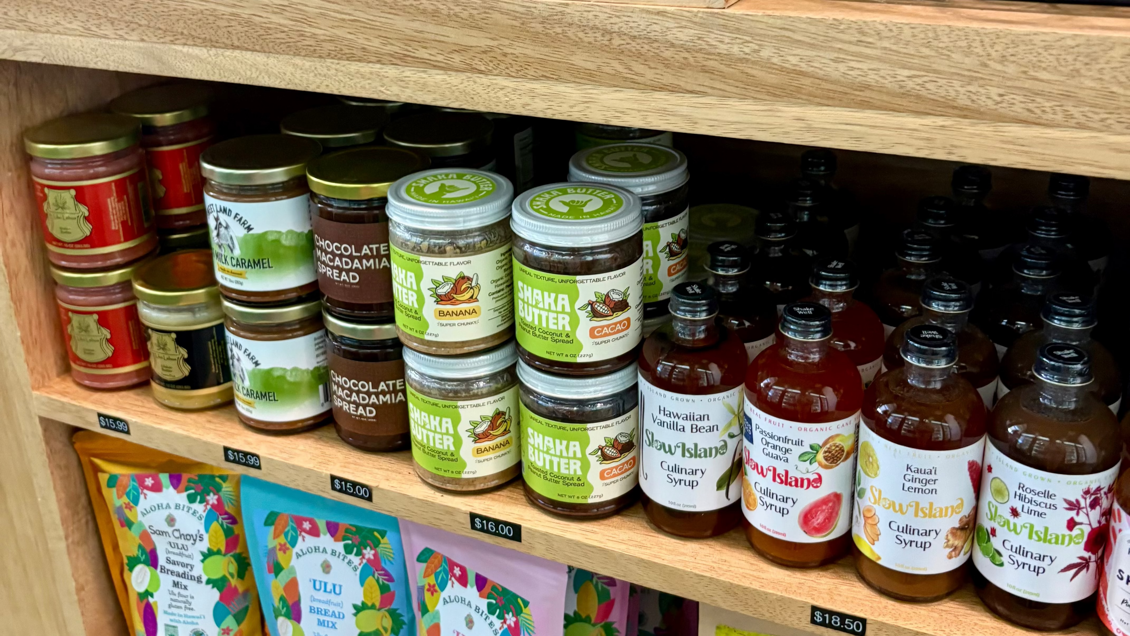 Shelf with jars, bottles, and packets of various products in a store setting.