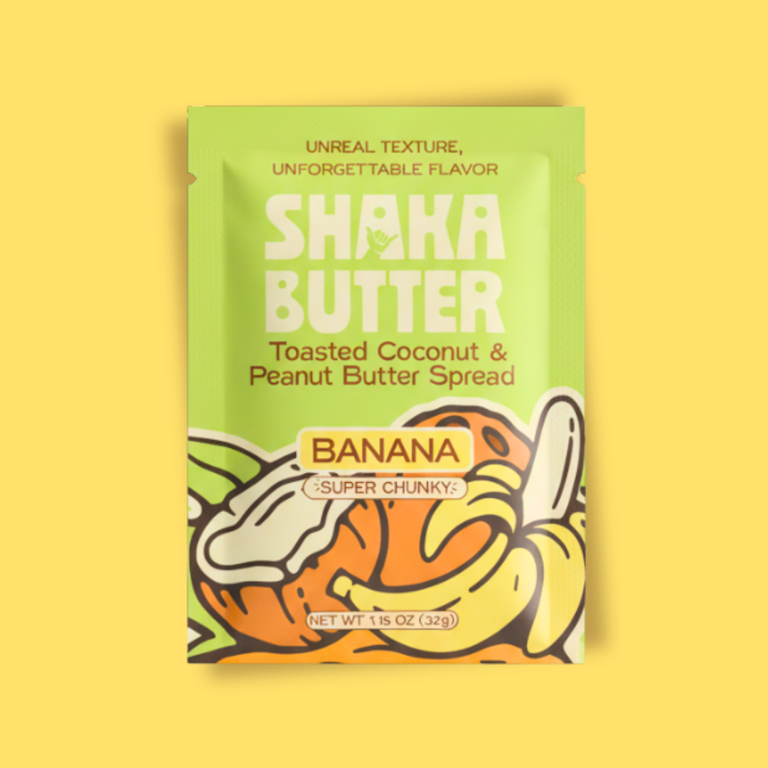 Shaka Butter Toasted Coconut & Peanut Butter Spread single serve packaging on a yellow background